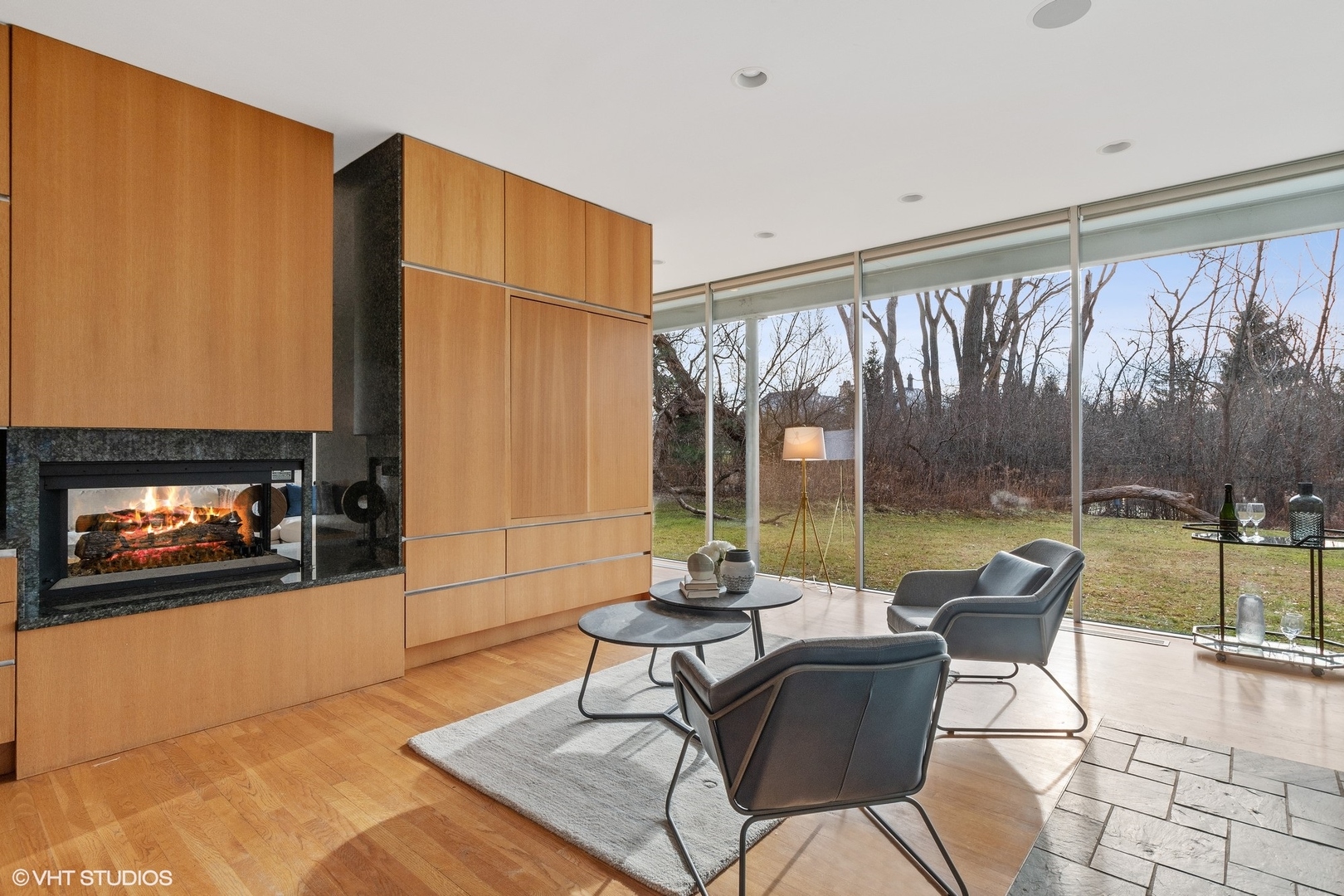 2747 Ridge Road Highland Park, IL 60035 - Photo 8 of 31 a living room with a fireplace furniture and a large window