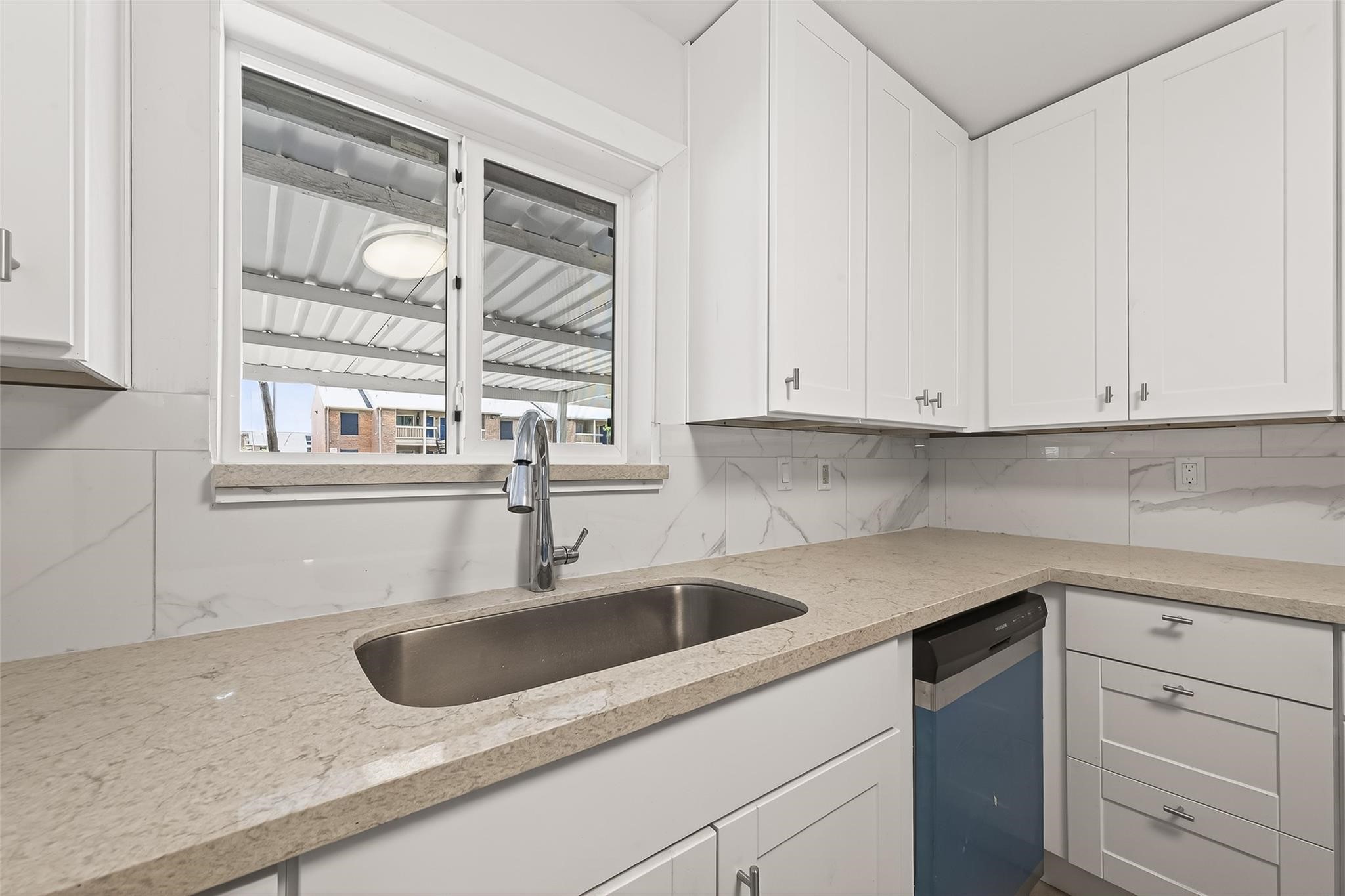 815 Brooks Avenue Rosenberg, TX 77471 - Photo 23 of 48 a kitchen with stainless steel appliances granite countertop a sink and a white cabinets