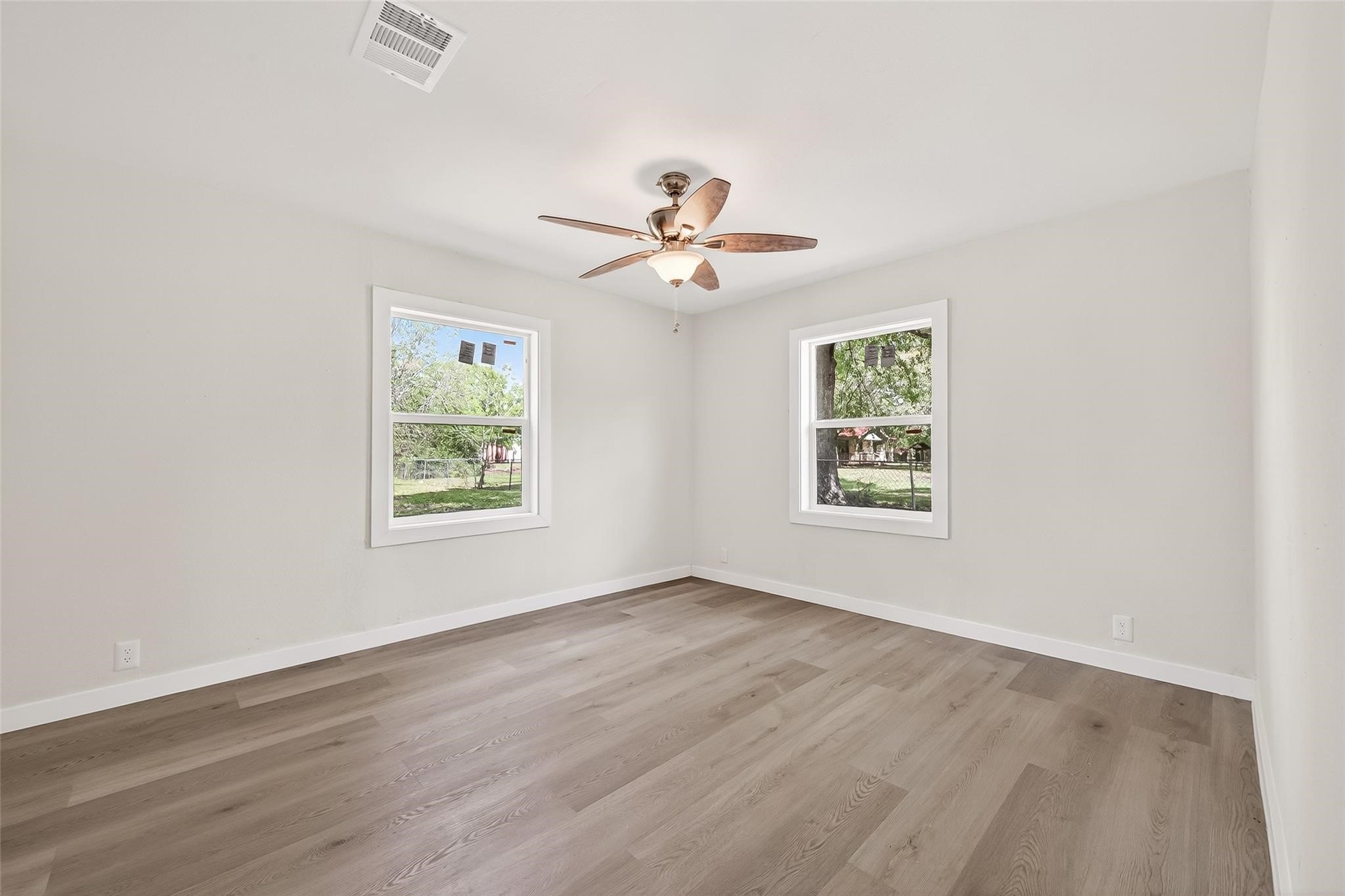 815 Brooks Avenue Rosenberg, TX 77471 - Photo 35 of 48 wooden floor in an empty room with a window