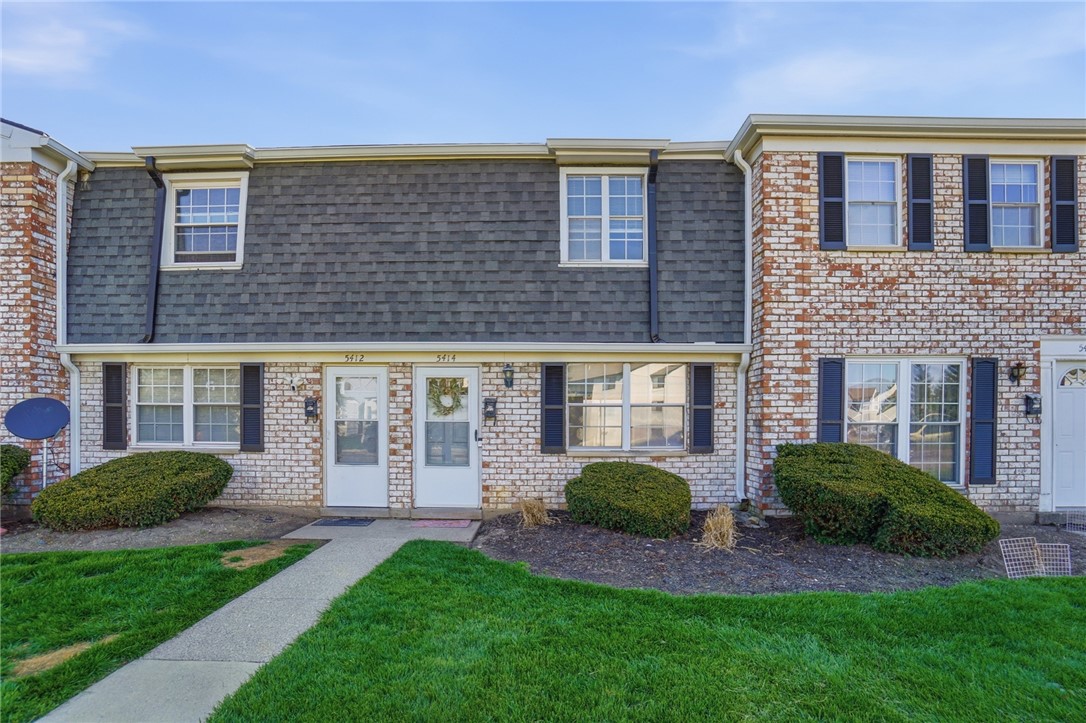 5414 Lamme Road Dayton, OH 45439 - Photo 3 of 32 This charming townhome features a classic brick exterior, providing timeless appeal.