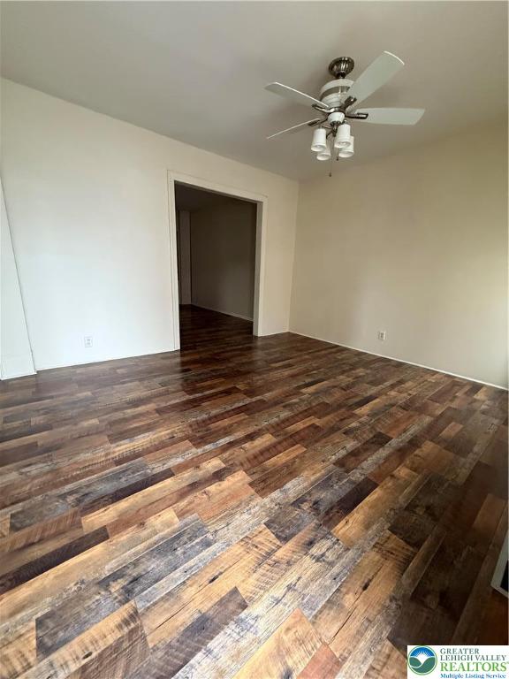 518 Oak Street Allentown, PA 18102 - Photo 2 of 11 a view of a room with wooden floor and a ceiling fan