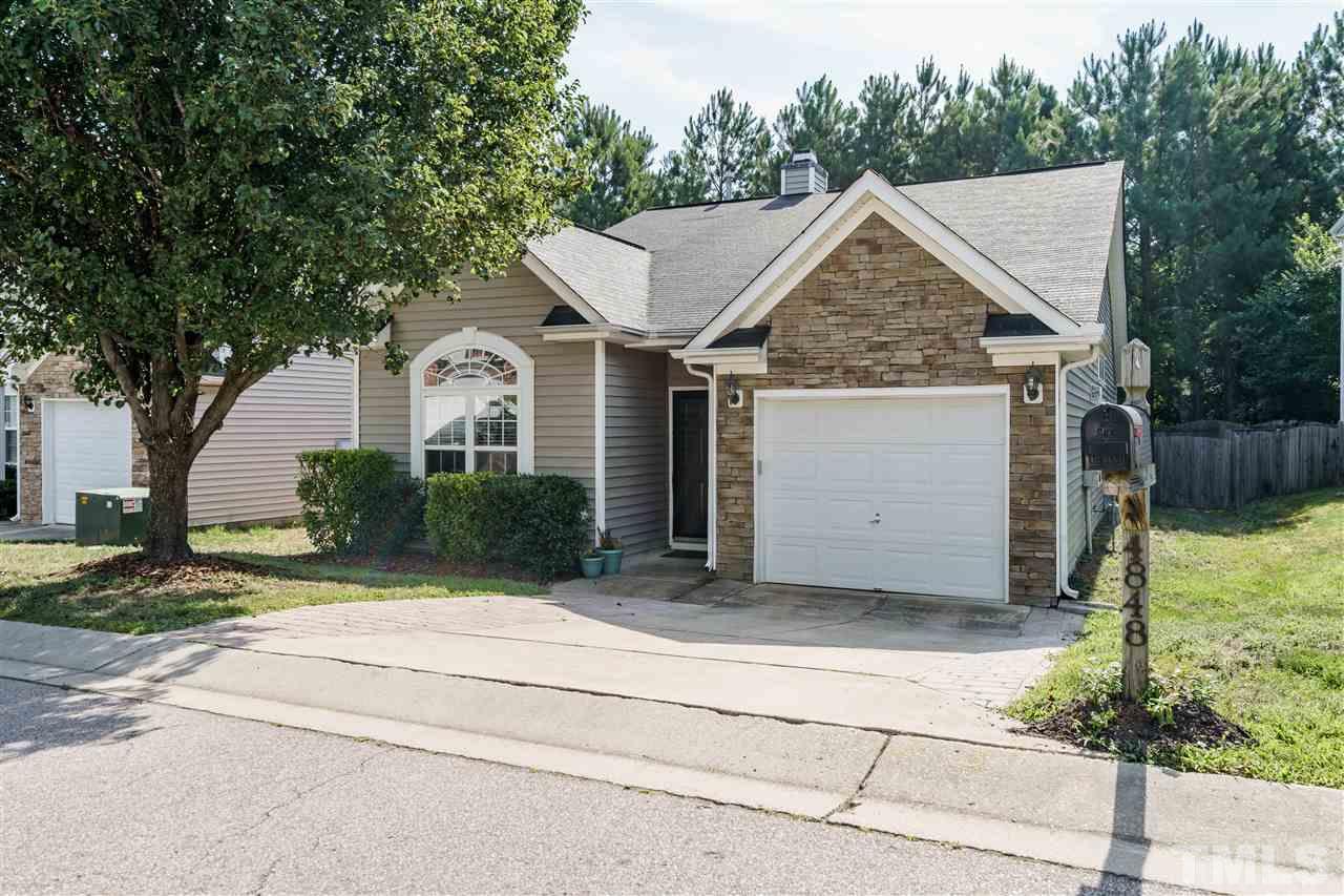 4848 Tommans Trail Raleigh, NC 27616 - Photo 2 of 22 a view of a house with a yard plants and large tree