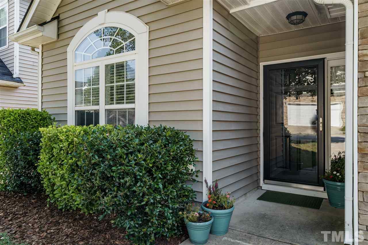 4848 Tommans Trail Raleigh, NC 27616 - Photo 3 of 22 a potted plant in front of a house