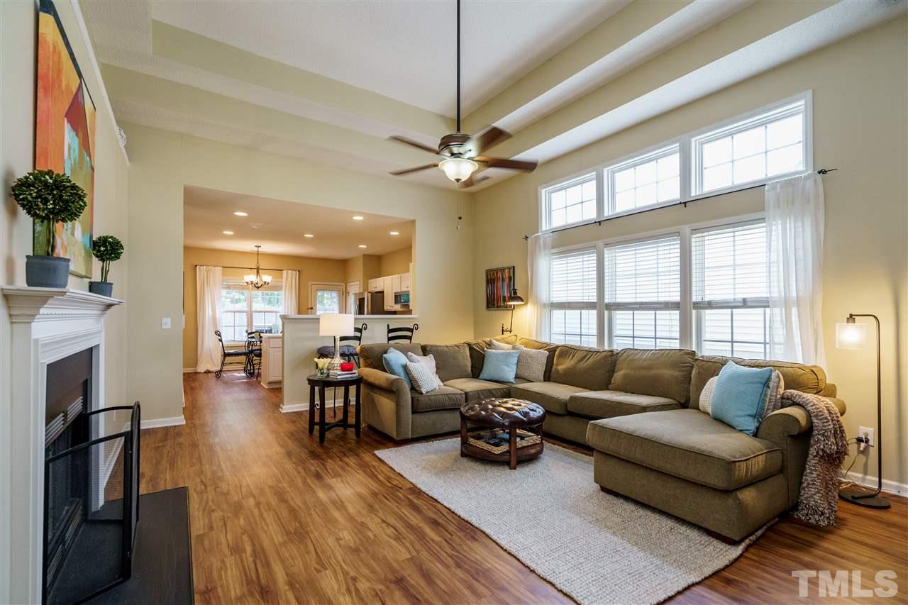 4848 Tommans Trail Raleigh, NC 27616 - Photo 6 of 22 a living room with furniture fireplace and flat screen tv