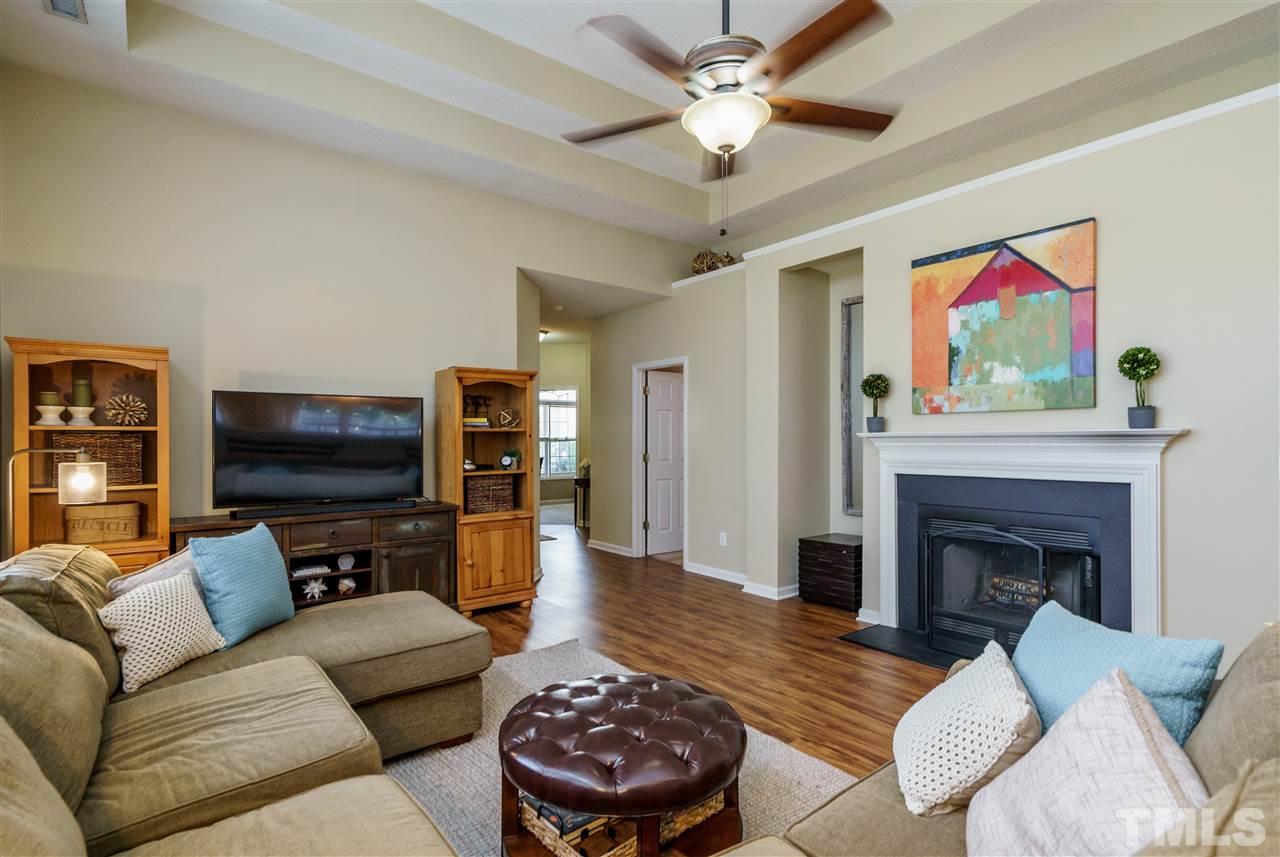 4848 Tommans Trail Raleigh, NC 27616 - Photo 8 of 22 a living room with furniture and a flat screen tv