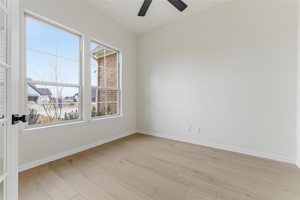 114 Brandywine Trail Rhome, TX 76078 - Photo 7 of 27 an empty room with windows