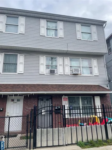 a front view of a house with a balcony