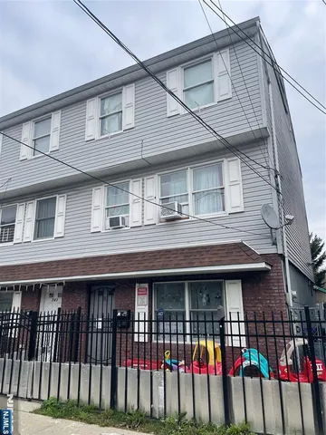 a front view of a house with glass windows