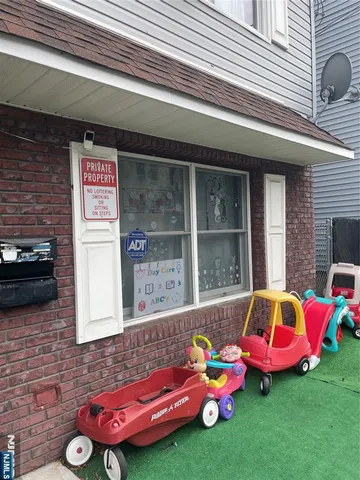 a backyard of a house with outdoor seating
