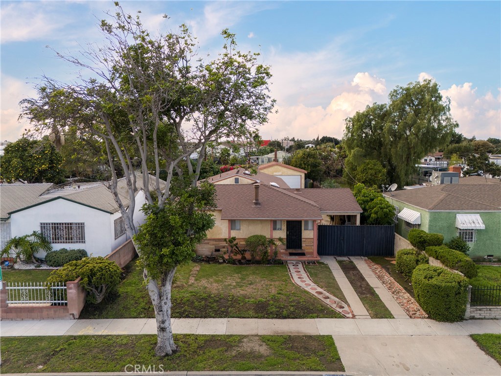 12623 Slater Avenue Compton, CA 90222 - Photo 1 of 35 a view of house with garden space and swimming pool