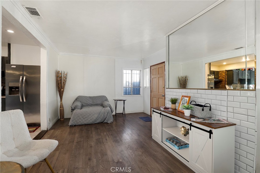 12623 Slater Avenue Compton, CA 90222 - Photo 15 of 35 a living room with furniture and a flat screen tv