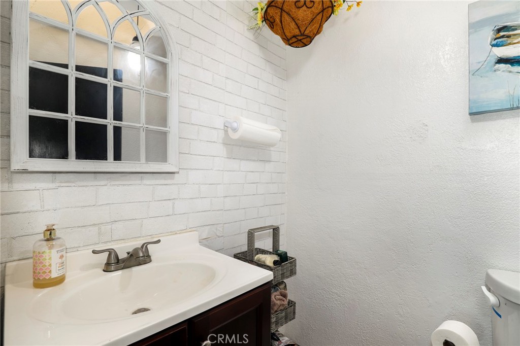 12623 Slater Avenue Compton, CA 90222 - Photo 16 of 35 a bathroom with a sink and a toilet