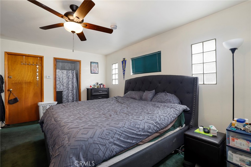 12623 Slater Avenue Compton, CA 90222 - Photo 19 of 35 a bedroom with a bed dresser and a window