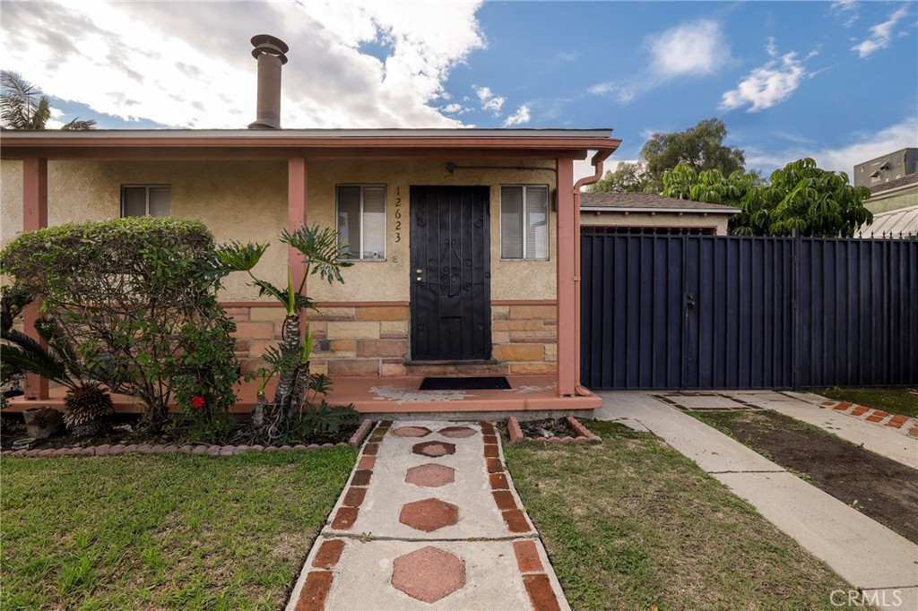 12623 Slater Avenue Compton, CA 90222 - Photo 2 of 35 a front view of a house