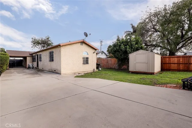 a view of a house with a yard and a garage