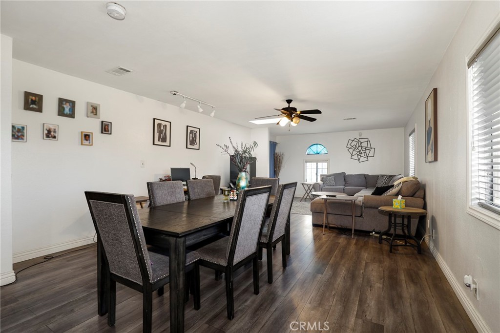 12623 Slater Avenue Compton, CA 90222 - Photo 6 of 35 a view of a dining room with furniture and wooden floor