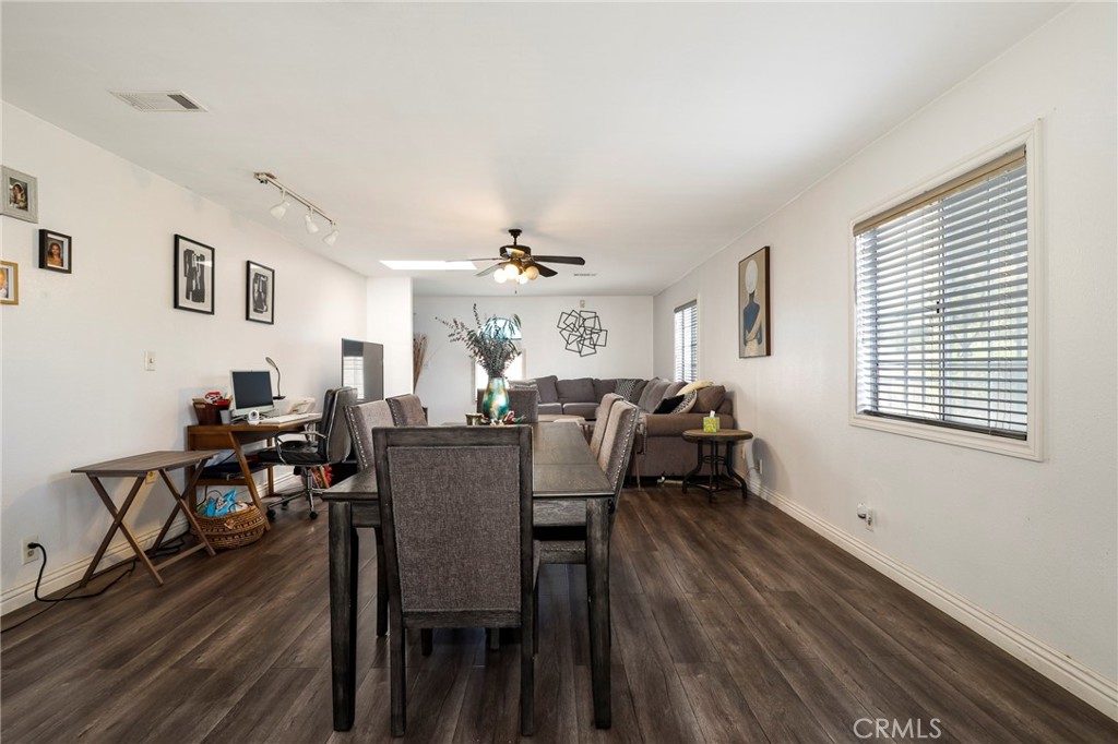 12623 Slater Avenue Compton, CA 90222 - Photo 7 of 35 a view of a dining room with furniture and wooden floor