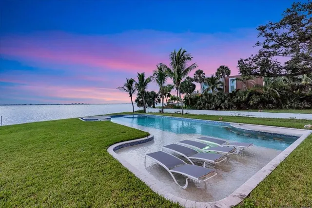 a view of a living room and hall way with furniture