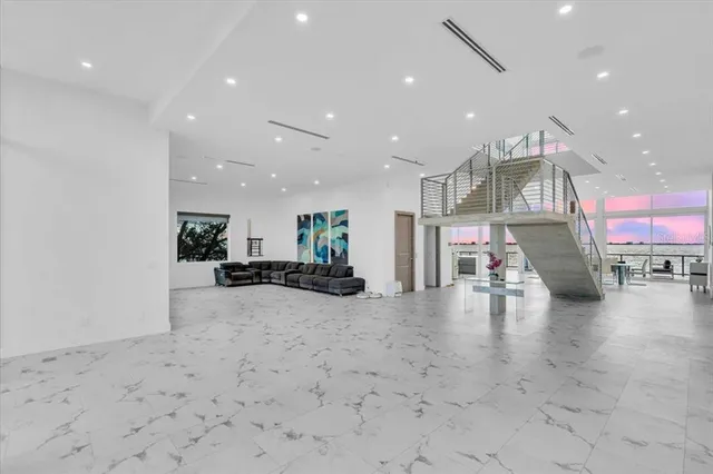 a view of dining room with wooden floor and a floor to ceiling window