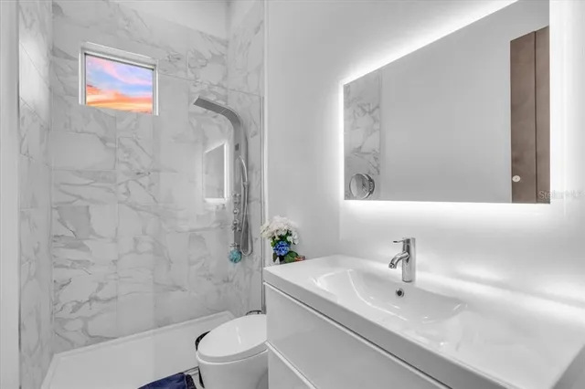 a spacious bedroom with a bed and a couch