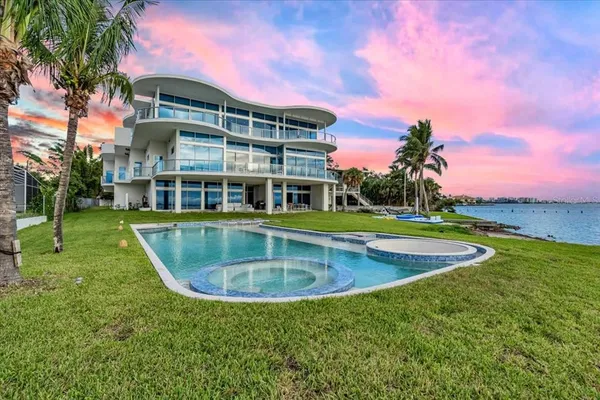 a view of a lake with a yard