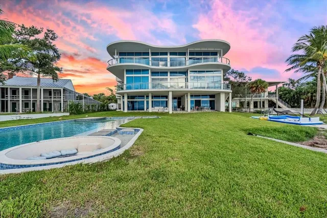a view of swimming pool with outdoor seating