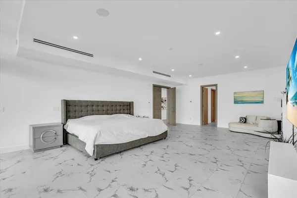 a view of a walk in closet and bathroom