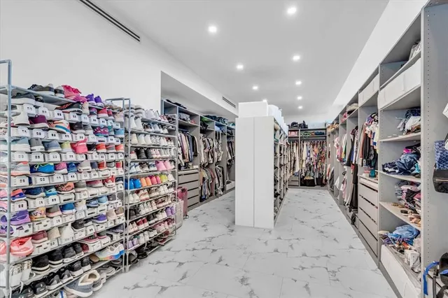 a room with gym equipment and large mirror