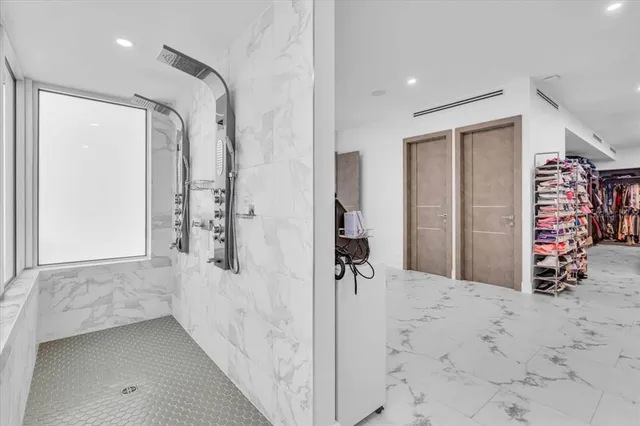 an aerial view of a house with a garden and lake view