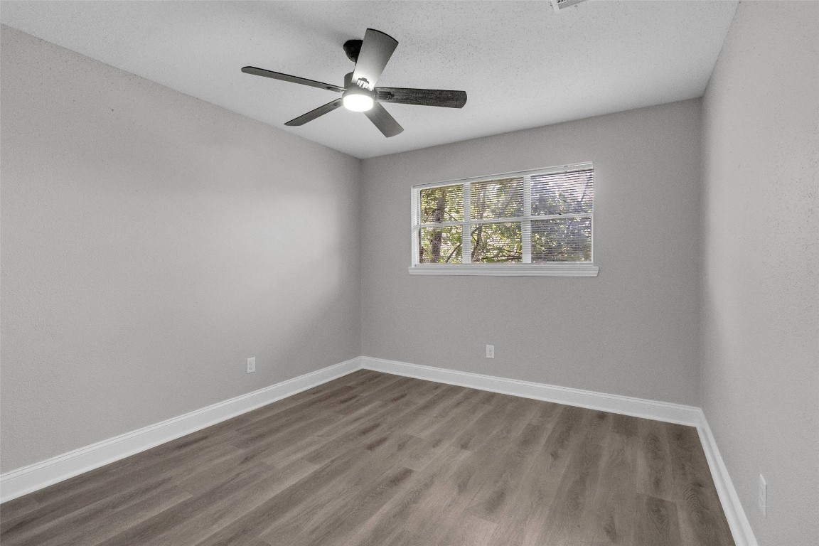 3613 Crane Street Houston, TX 77026 - Photo 13 of 23 wooden floor in an empty room with a window