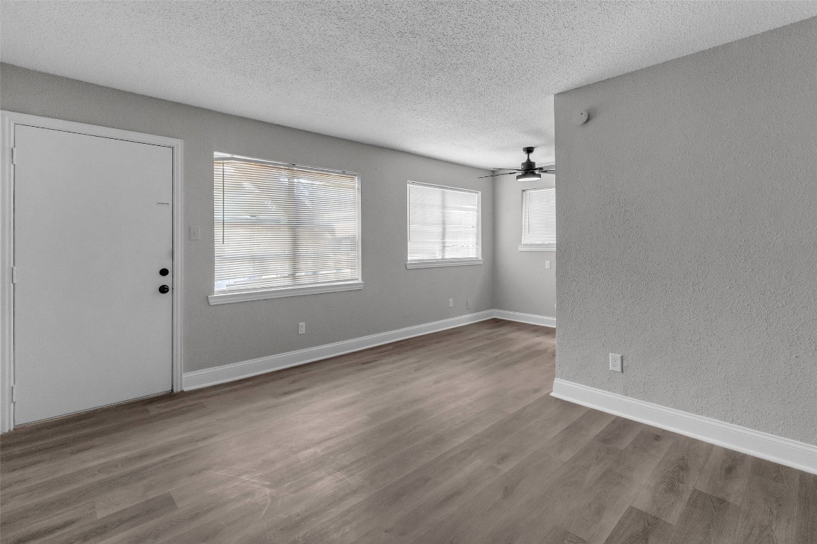 3613 Crane Street Houston, TX 77026 - Photo 14 of 23 an empty room with wooden floor and windows