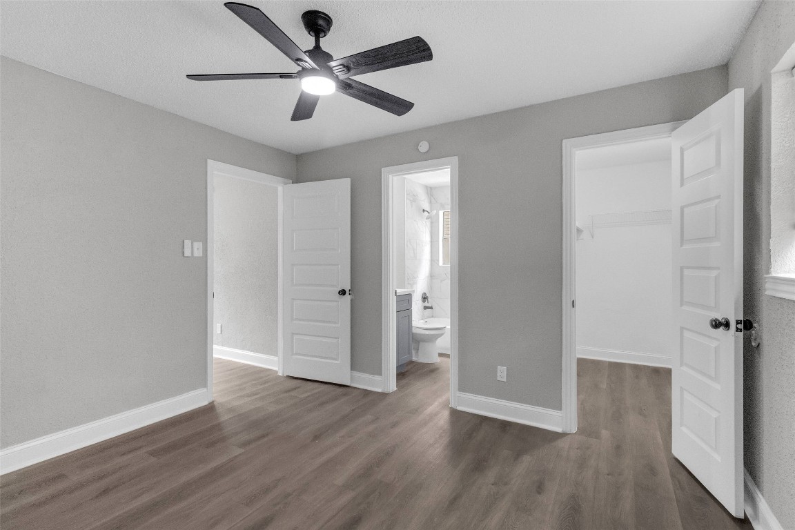 3613 Crane Street Houston, TX 77026 - Photo 16 of 23 an empty room with wooden floor ceiling fan and windows