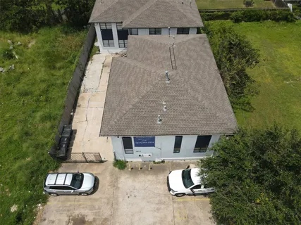 an aerial view of a house with garden