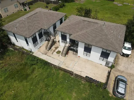 an aerial view of a house with garden