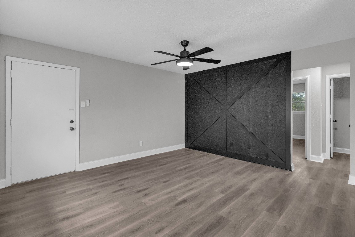 3613 Crane Street Houston, TX 77026 - Photo 3 of 23 a view of an empty room with wooden floor