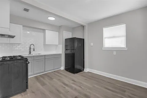 a bathroom with a sink toilet and bathtub