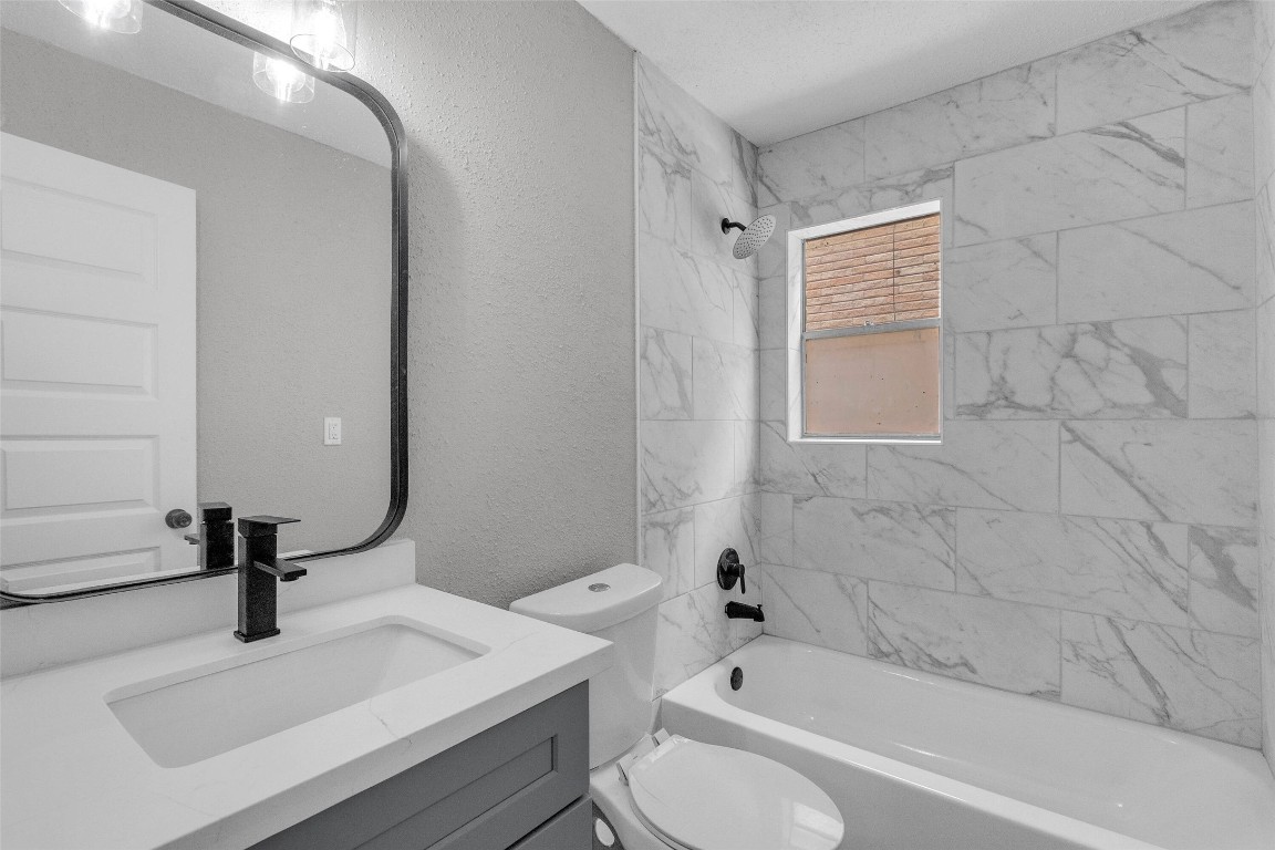 3613 Crane Street Houston, TX 77026 - Photo 9 of 23 a bathroom with a sink toilet and shower