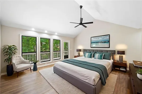 a spacious bedroom with a bed and a couch