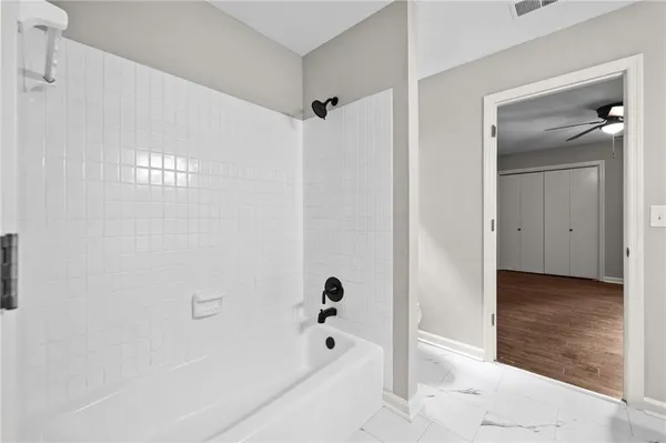 a view of a bathroom with a bathtub