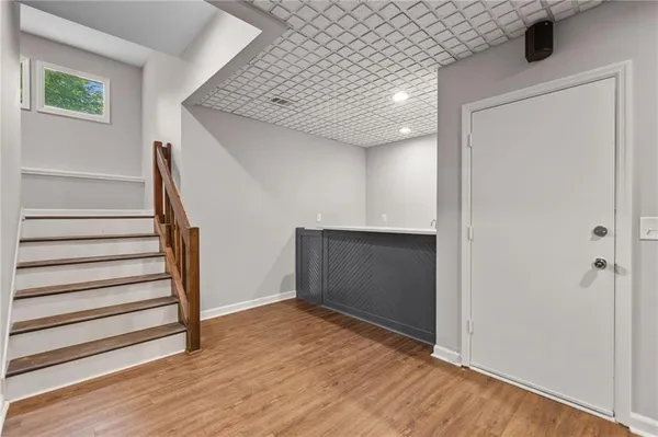 a view of entryway with wooden floor