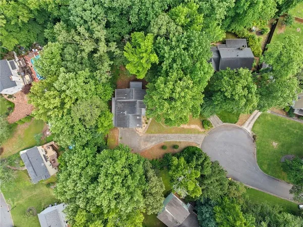 an aerial view of a house with a yard and a garden