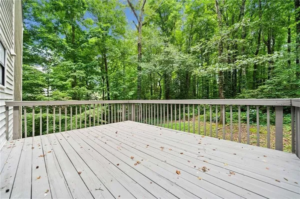 a balcony with view of wooden floor