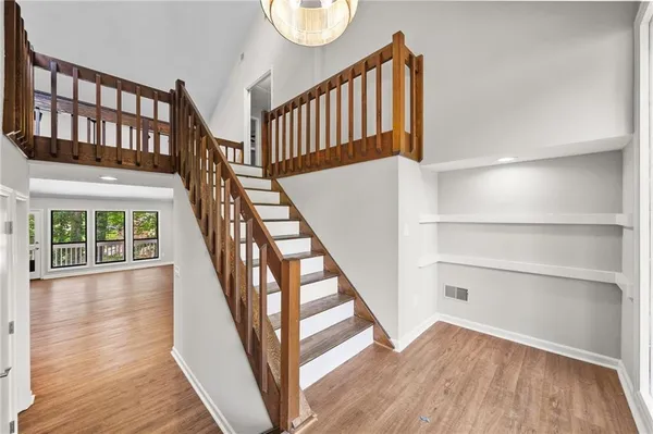 a view of an entryway with wooden floor
