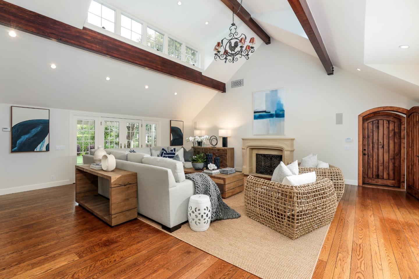 96 Laburnum Road Atherton, CA 94027 - Photo 12 of 40 a living room with furniture a fireplace and wooden floor