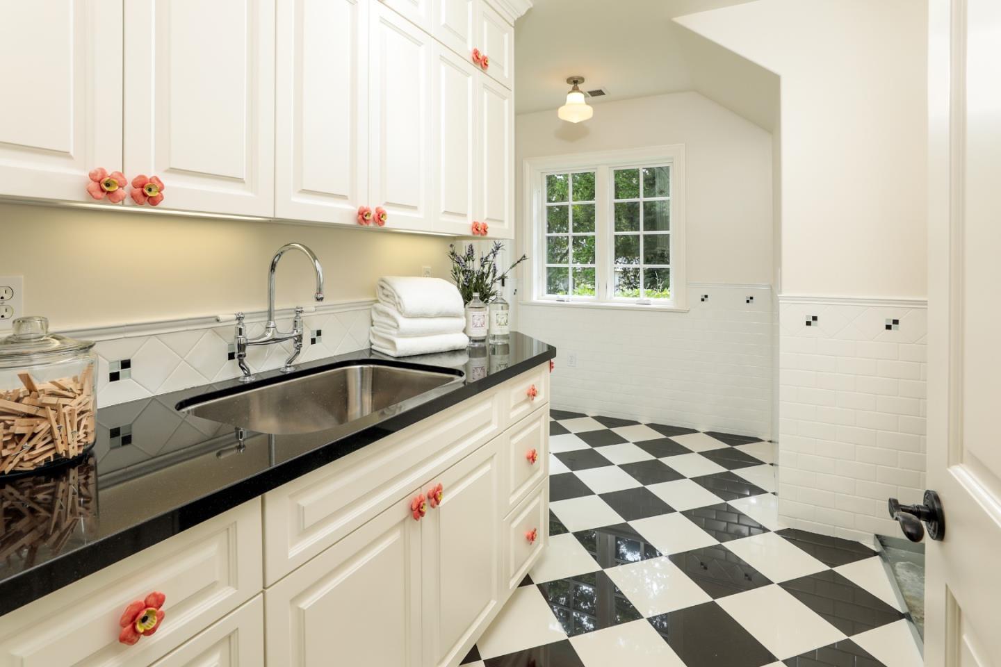 96 Laburnum Road Atherton, CA 94027 - Photo 27 of 40 a kitchen with a sink a refrigerator and cabinets