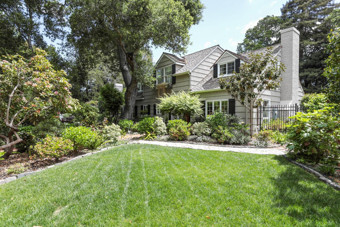 96 Laburnum Road Atherton, CA 94027 - Photo 5 of 40 a front view of a house with a yard and fountain