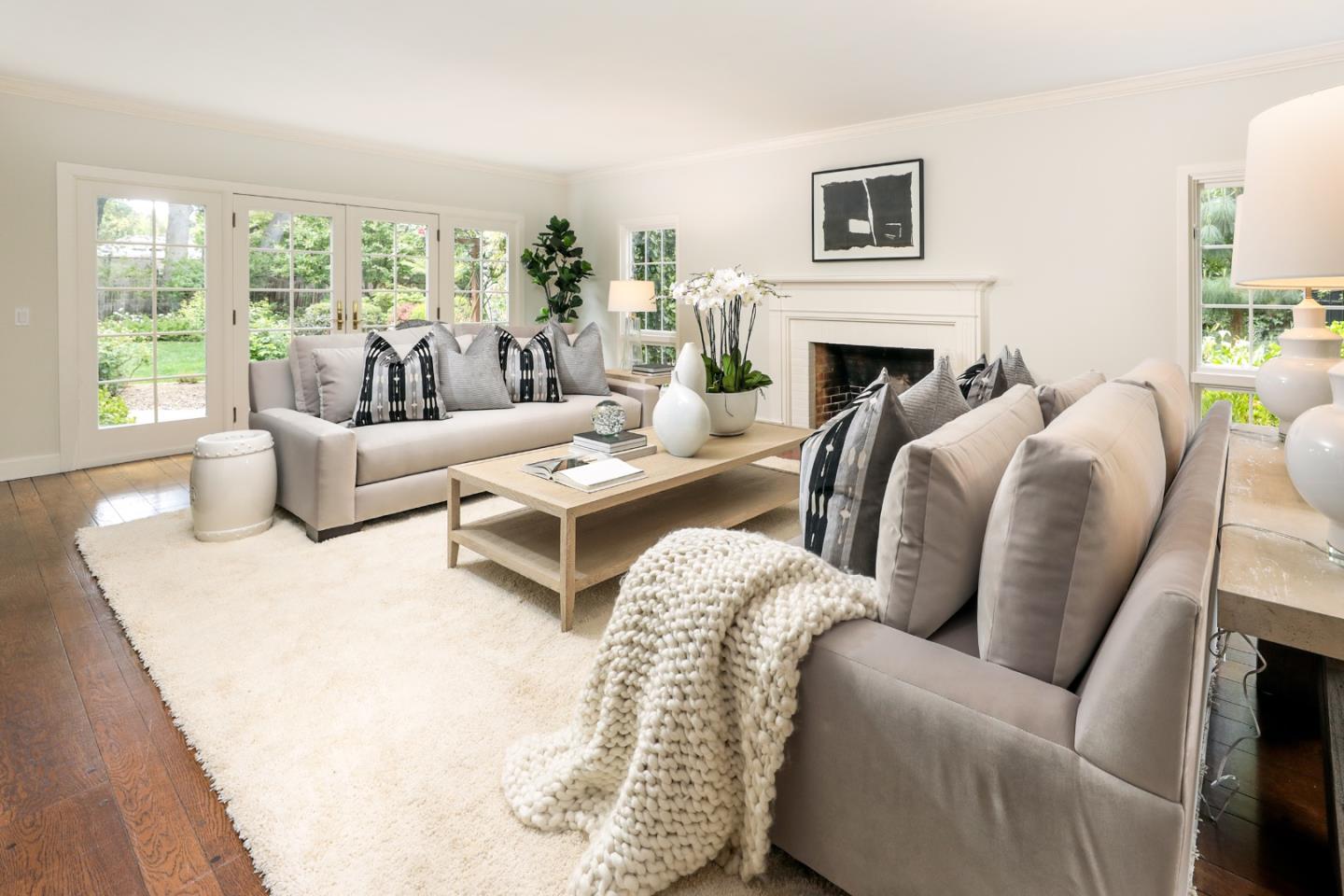 96 Laburnum Road Atherton, CA 94027 - Photo 8 of 40 a living room with furniture fireplace and a large window