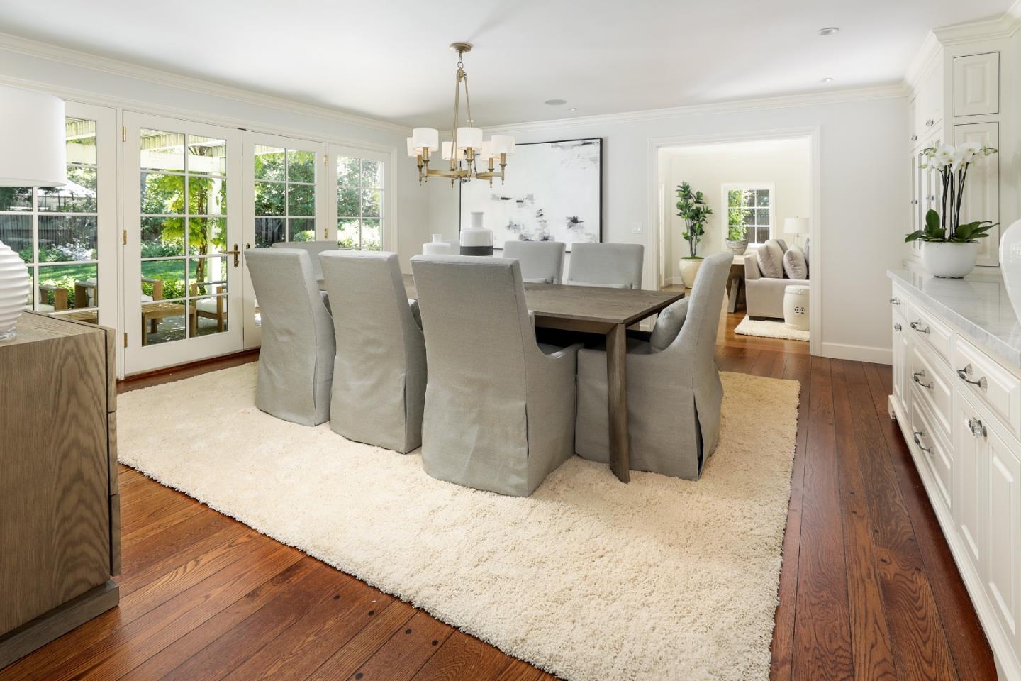 96 Laburnum Road Atherton, CA 94027 - Photo 10 of 40 a dining room with furniture a chandelier and wooden floor