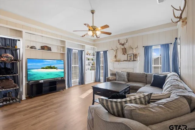 a living room with furniture and a flat screen tv
