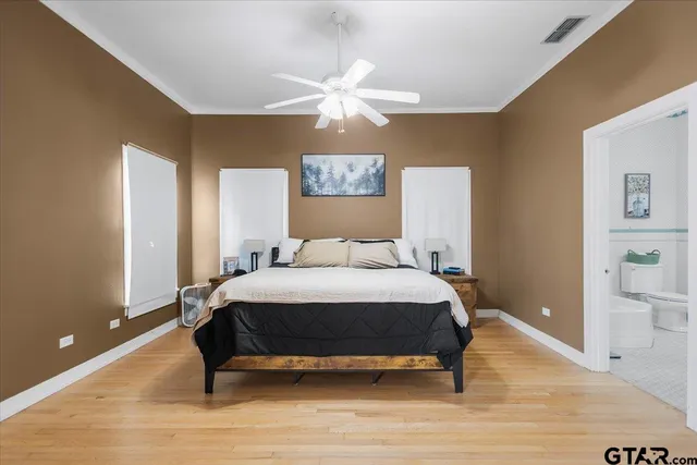 a bedroom with a bed and a table